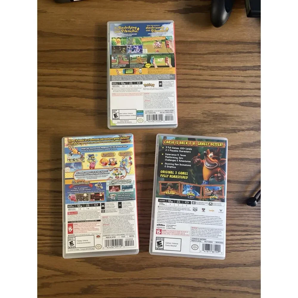 Nintendo Switch Console Gray Bundle with Games Kirby Pikachu Crash and Case